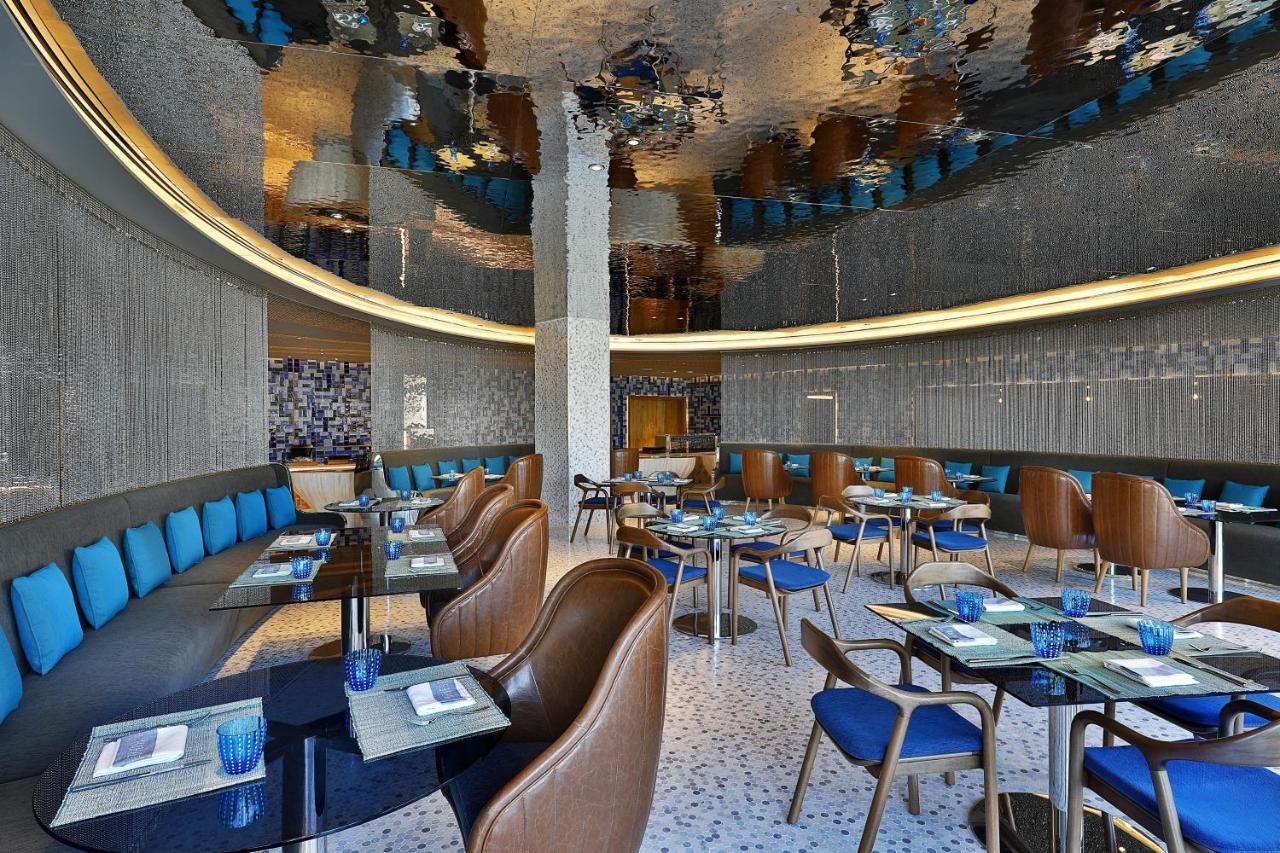 ホテル W マスカット エクステリア 写真 The interior of the restaurant